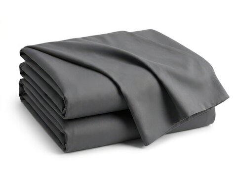 Folded dark grey bed sheets set with soft fabric texture in clean studio lighting for home decor