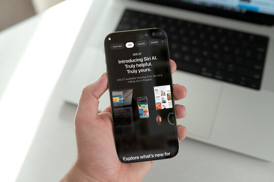 Person holding smartphone introducing new ai assistant software