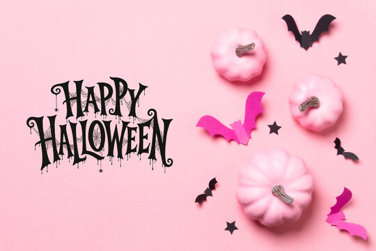 Happy Halloween lettering with pink pumpkins, flying bats and stars on a pastel background, ideal for greeting cards, invitations, posters and seasonal advertising.