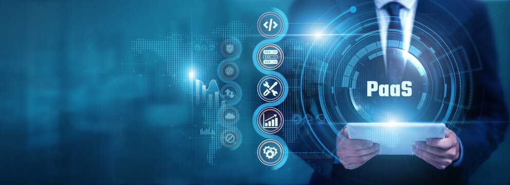 Businessman using tablet analyzing Paas and cloud data, monitoring application platforms, optimizing digital resources, improving scalability and supporting modern software development