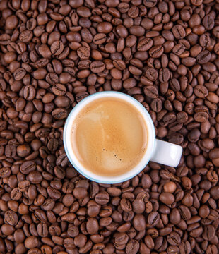 Espresso against a background of coffee beans