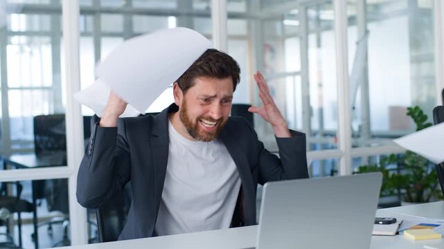 Overworked stressed Caucasian middle-aged business man reading letters bank reject throwing papers away yelling with desperate male mature businessman throw documents high bills taxes yell in office