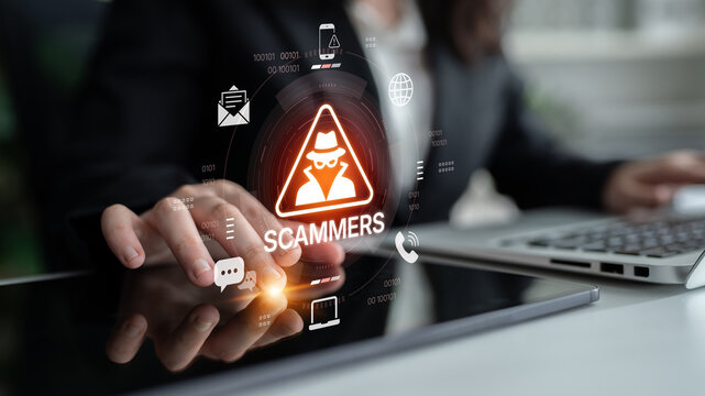 A businesswoman engages with a tablet, highlighting online scams and digital security alerts. This image emphasizes the importance of awareness in modern digital landscapes. Nascent