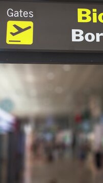 Digital sign showing the direction to the biometric border gates at an airport, introducing a new automated control system for passengers' identity verification and contactless travel