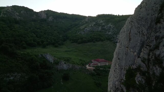 Templul cavalerilor castle stands on a green hill overlooking the trascau mountains