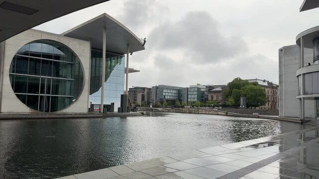 Marie-Elisabeth-Lueders House building facade on Spree river in Berlin, Germany. Modern exterior of scientific service center of the German Parliament on cloudy summer day. Berlin city destination