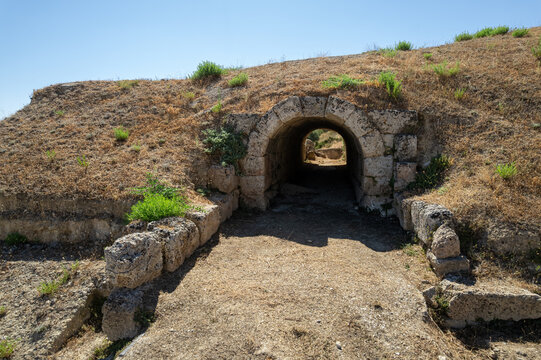 A stone-vaulted public entrance to the ancient theater of Sicyon in Corinth, Greece, showing the arched passage that gave spectators access to the seating area.