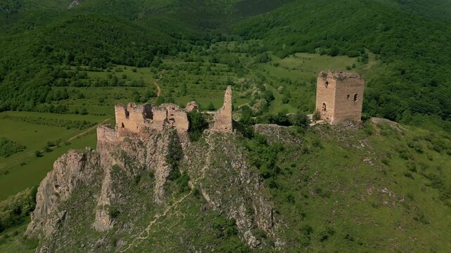 Aerial view of fortress ruins overlooking trascau mountains in transylvania