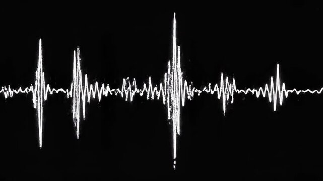 Sound wave visualizer in contrasting patterns during a digital audio analysis with minimal lighting for broadcast