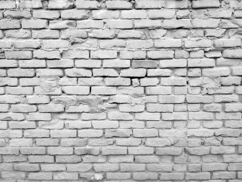 Weathered brick wall texture with uniform aging and subtle cracks for architectural or design projects