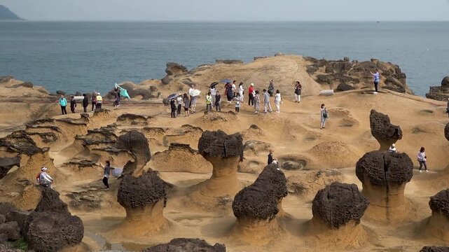 Trip to Yehliu Geopark in Taiwan. Beautiful travel video in Taipei. Nature landscape with sandy erosion mountains. Summer vacation at famous park.