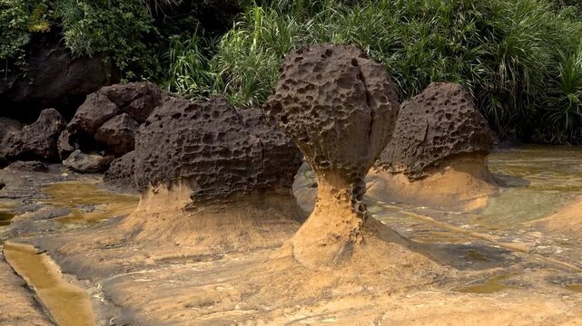 Trip to Yehliu Geopark in Taiwan. Beautiful travel video in Taipei. Nature landscape with sandy erosion mountains. Summer vacation at famous park.