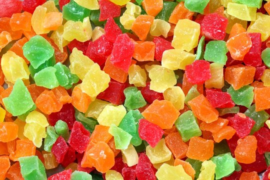 Marmalade candies of different colors texture close up top view. Coloured marmalade cubes
