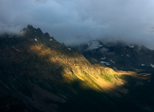 Stormy alpine landscape in Svaneti on cloudy summer day. Caucasus peaks in Georgia. Amazing view on wild georgian nature.	