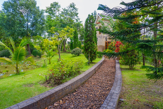Stone pathway in garden and footpath in picturesque summer park and staircase in backyard,Paving stones on floor in park,Garden landscape design,space for text.