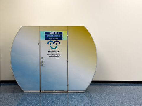LAS VEGAS, NV, APR 28, 2026: Front view of Mamava nursing pod door, showing keypad lock, handle, and signage against a plain wall, Harry Reid International Airport