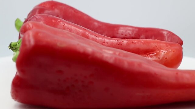 Red long chili peppers in focus.