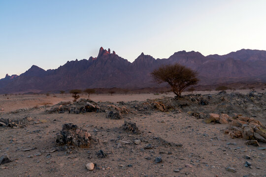 Dramatic wide-angle view of the sharp granite peaks and rugged mountain ridges of Jabal Shar in Tabuk