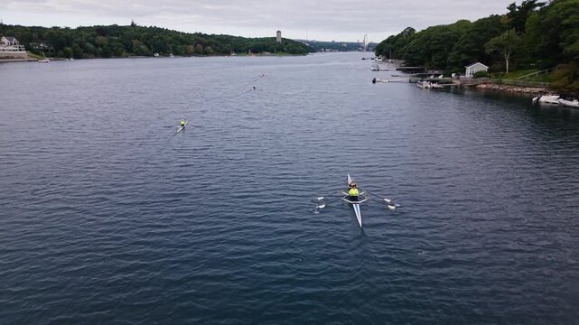 A rowing crew moves in perfect synchrony across Halifax Bay,