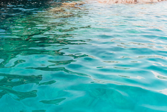 Turquoise Mediterranean Sea Water with Sunlight Reflections and Natural Underwater Texture