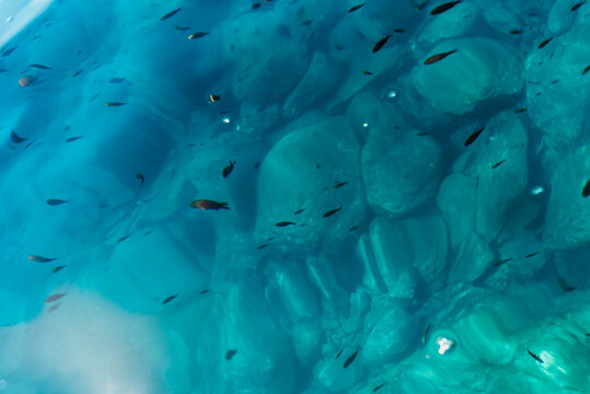 Turquoise Mediterranean Sea Water with Sunlight Reflections and Natural Underwater Texture
