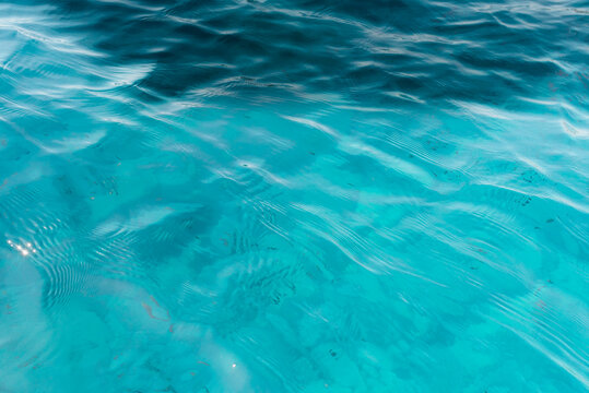 Turquoise Mediterranean Sea Water with Sunlight Reflections and Natural Underwater Texture