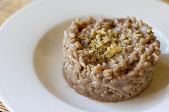 Bitto Cheese Risotto With Pomegranate And Walnuts