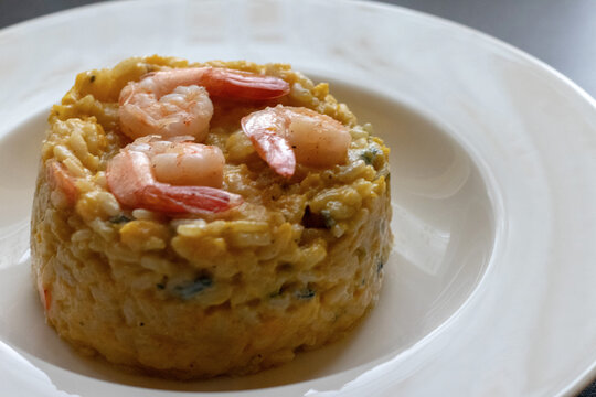 Close-Up Pumpkin Gorgonzola Risotto With Shrimp