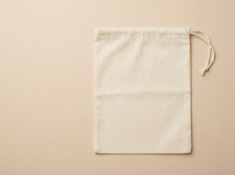 Clean unbleached cotton muslin produce bag with drawstring flat lay