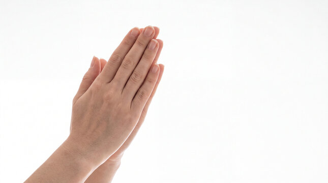 Close up of woman hands pressed together in prayer or greeting