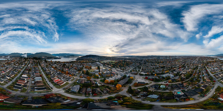 Aerial 360 Panorama Over Burnaby Suburbs With Vancouver Skyline, Mountains and Dramatic Sky