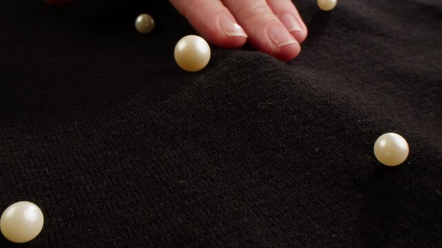 Black woman wool coat background, natural sheep wool close-up macro coat, luxury furniture, buttons. 