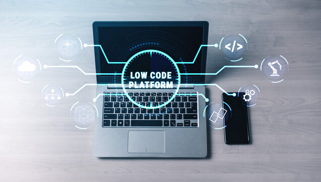 Modern Workspace with Laptop and Smartphone Showcasing Low Code Platform Technology and Digital Connectivity Concepts Quark.