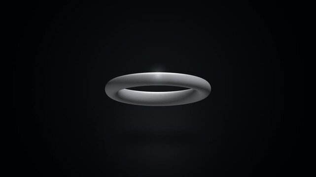Minimalist 3D Rotating Metallic Silver Torus Ring Floating on Dark Background Motion Graphic
