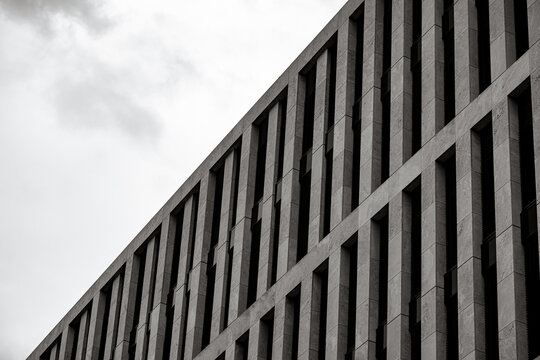 Berlin, Germany - July 5, 2026: Contemporary commercial architecture features geometric facades, repetitive window patterns and modern materials in central Berlin.