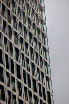 Berlin, Germany - July 5, 2026: Contemporary commercial architecture features geometric facades, repetitive window patterns and modern materials in central Berlin.