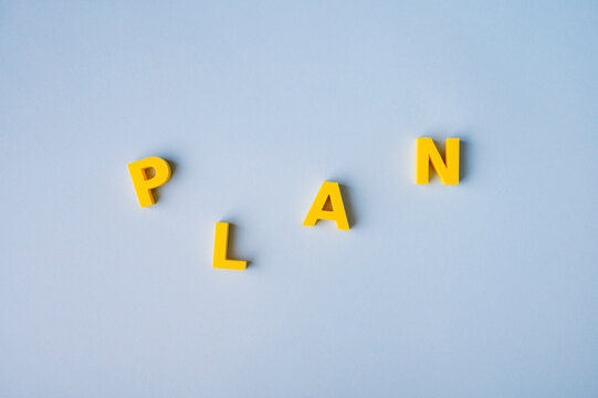 Planning process, business strategy and organizing ideas with scattered PLAN letters