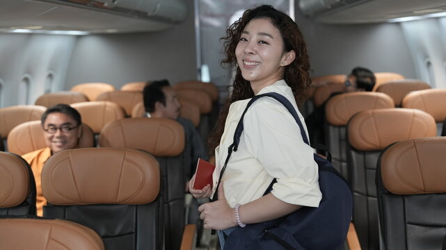happy tourist girl on plane