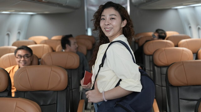 happy tourist girl on plane