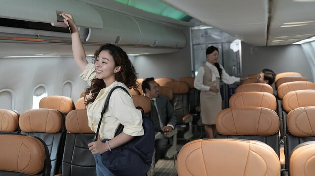 happy tourist girl on plane