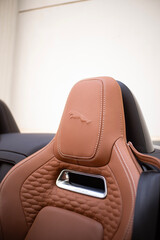 Obraz premium Jaguar F-Type Cabriolet Sports Car Tan Leather Seat Headrest Interior Detail