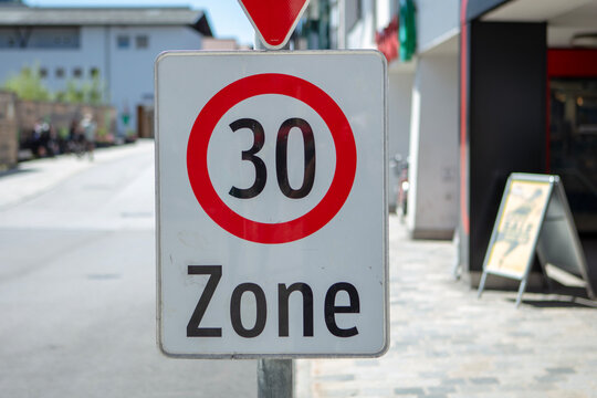 German Zone 30 traffic sign indicating a reduced speed limit in an urban area. 
