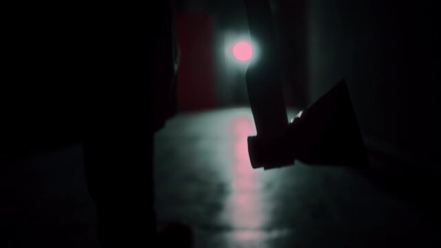 Demon with horns crawling in corridor. Silhouette of devil in darkness. Halloween, a traditional American holiday concept. Evil magician making rite or sacrifice during full moon, evil spirit, satan.