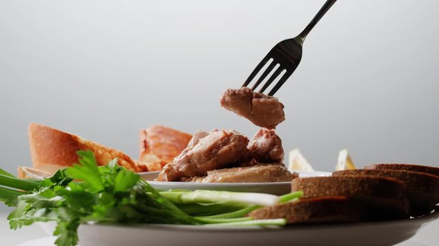 Cod liver superfood can, omega 3 Smoked cod liver in oil in open tin can with fresh greens on wooden table. Seafoods delicacy