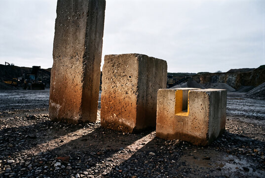 Concrete blocks in quarry light for industrial design background