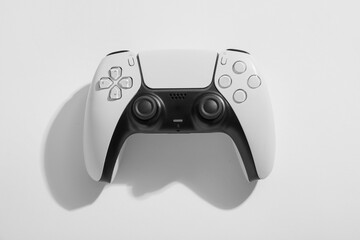 Gaming and entertainment technology, modern wireless video game controller for console play isolated on a clean white background with soft shadow © Pixel-Shot