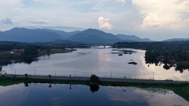 High angle shot showcases tranquil lake with mountain reflections at Tasik Raban