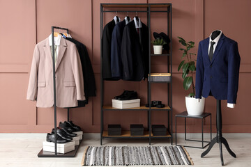 Shelving unit, rack, mannequin, different stylish male suits and shoes in dressing room