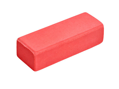 Vibrant, glossy red rectangular eraser sits isolated on a clean.