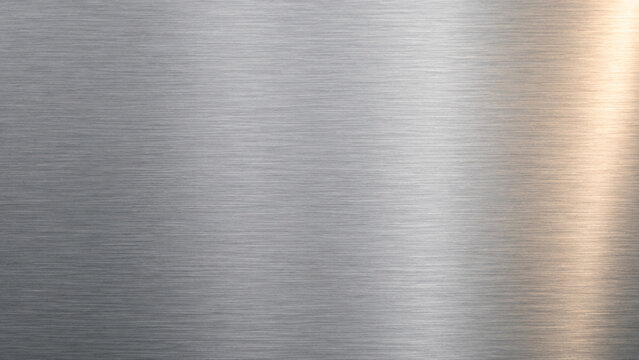 Soft Brushed Aluminum Surface with Warm Reflection and Copy Space